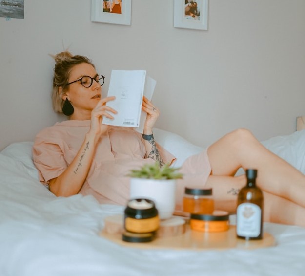girl reading in bed